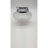 Top heavy cut glass sugar jar with spring tongs attached to lid