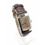 Dunhill Tank Style Watch, angled glass, with a brown leather strap, Watch Face is 35 x 24mm