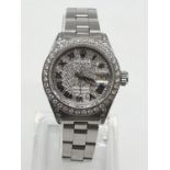 Rolex datejust ladies watch with diamond encrusted face and bezel, 26mm face.