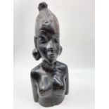 Ebony hand carved effigy of a bare breasted African tribal woman. 29cm tall.