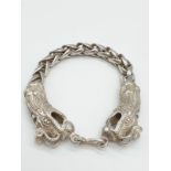 A Tibetan silver, braded chain, bracelet with two Chinese dragon heads Bracelet length: 22cm,