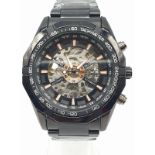 Gentleman's ESS Skeleton chronograph wristwatch. Automatic movement. Having black bezel with white