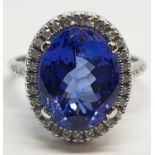 18ct white gold ring with 4ct tanzanite centre and encrusted diamond surrounding, weight 5.2g and