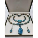 An Egyptian Revival necklace, bracelet and earrings set in a presentation box. Necklace length: