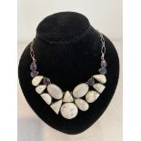 Silver stone set necklace. Having polished howlite stones to front with lengthy 55cm silver chain to