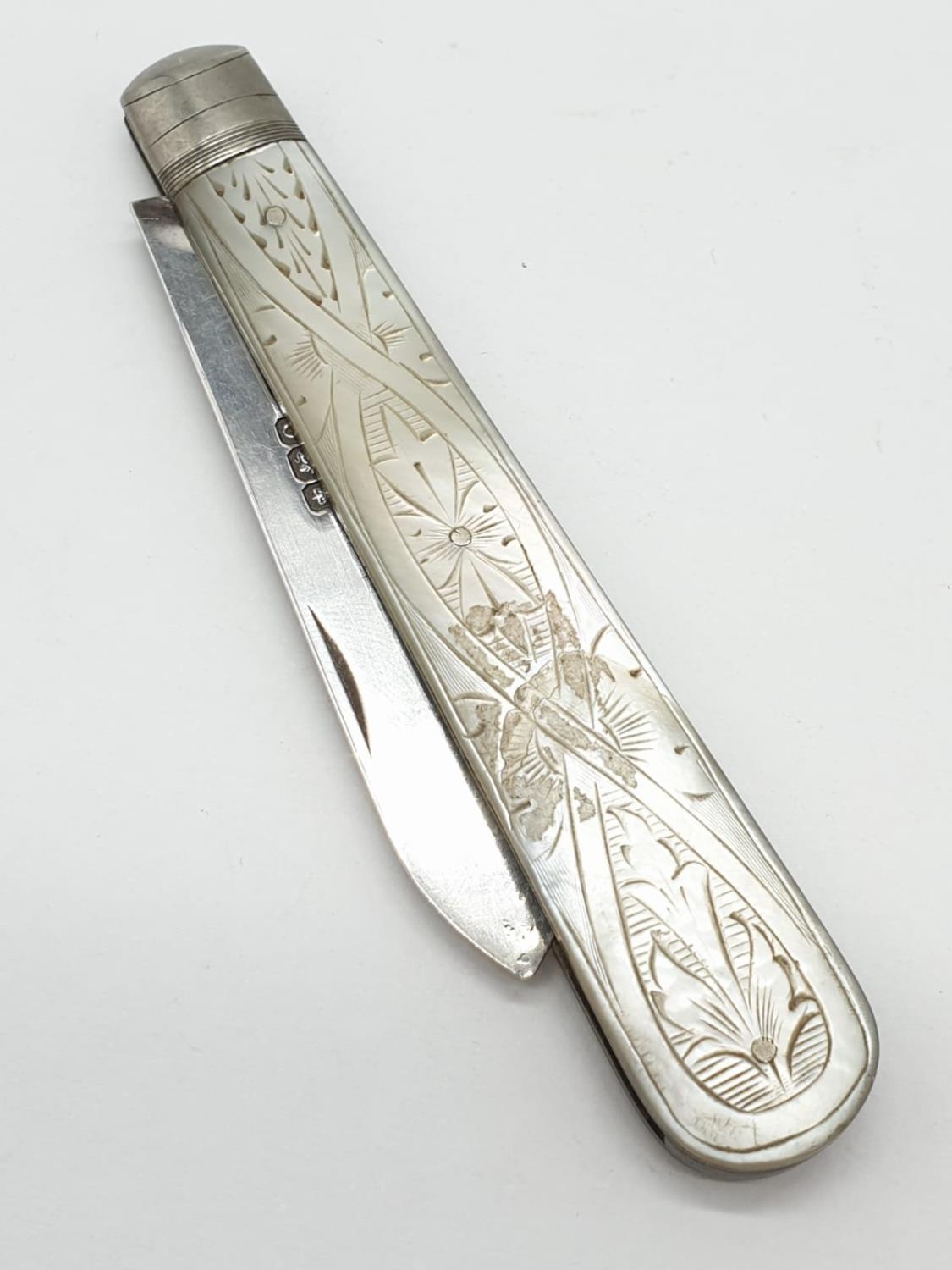 Silver bladed fruit knife having mother of pearl handle with intricate carving. Full hallmark for