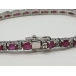 A Ruby Gemstone Tennis Bracelet with Diamonds in Sterling Silver