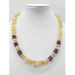 A Citrine and Amethyst Gemstone Necklace with Sterling Silver Clasp
