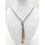 Silver gilt knot style necklace, chain 49cm long and the drop is 9cm long, weight 22.71g approx