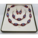 An artisan?s, beautiful, necklace, bracelet and earrings set in a presentation box. Each of the