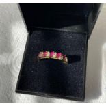 9ct Gold Ring having 5 rubies in baguette form interspaced with 4 pairs of Diamond Points. Full UK