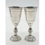 A pair kiddish cups 1913 made in Birmingham. Weight 8 grams in total. Height 8cm.