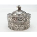 Vintage silver snuff / pill box. Circular form having snug fitting lid with finial. Raised chase