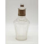 Interesting scent mixing bottle with miniature bottle as stopper. Silver collar and trim. 19cms
