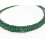 A Two Row Cabochon Emerald Necklace With Sterling Silver Clasp