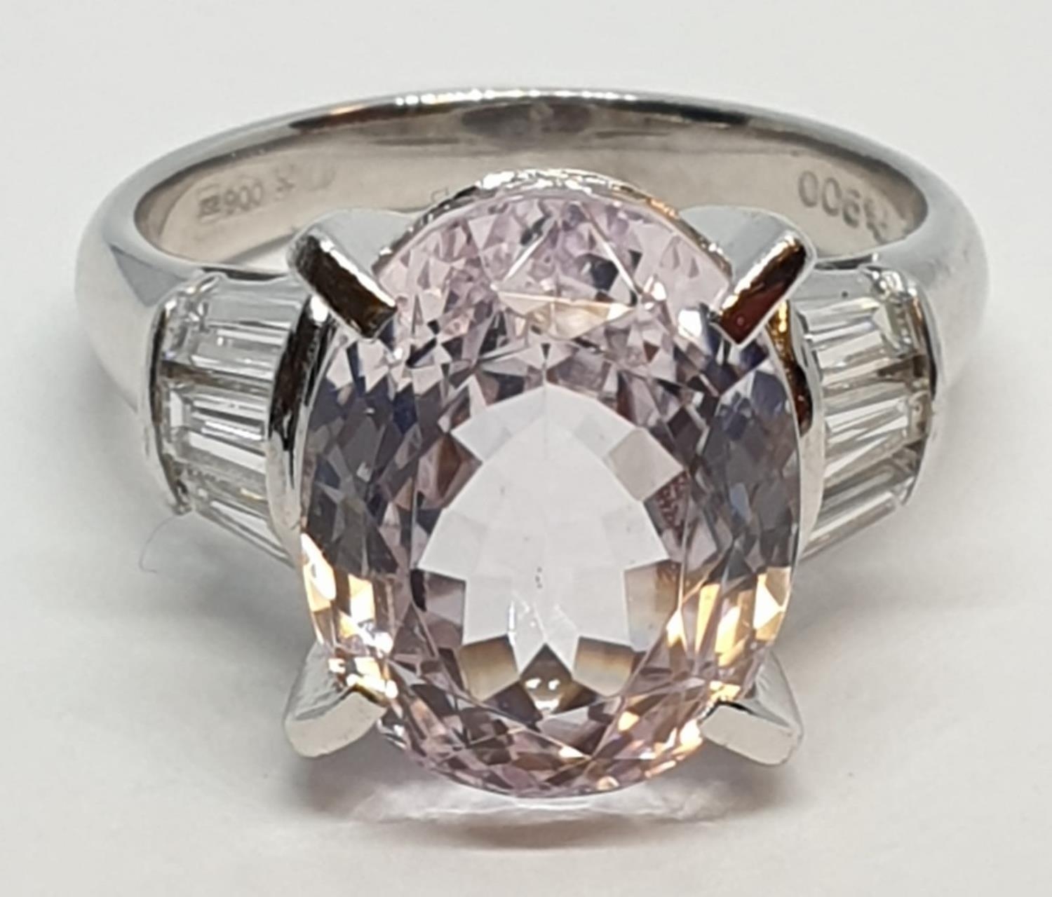 Platinum ring with a large 7.24ct cognizant stone centre and 0.64ct diamonds on shoulders, weight