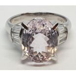 Platinum ring with a large 7.24ct cognizant stone centre and 0.64ct diamonds on shoulders, weight