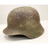 WW2 German M35 Helmet and liner with Normandy textured camouflage finish.