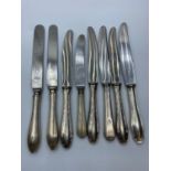 Assortment of 8x silver handled knives (8)