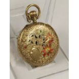 Antique ladies solid gold Pocket watch with enamel back , ticks but sometimes stops