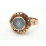 Vintage 14ct gold ring having large circular aquamarine stone to top with pierced design brim
