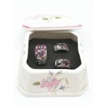 A silver (stamped 925) ring and earrings set depicting the Spring Cherry Blossom of Japan. Ring