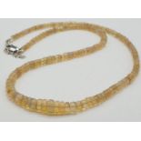 A fire opal gemstone single row necklace. Length 21cm, weight 9.16g.