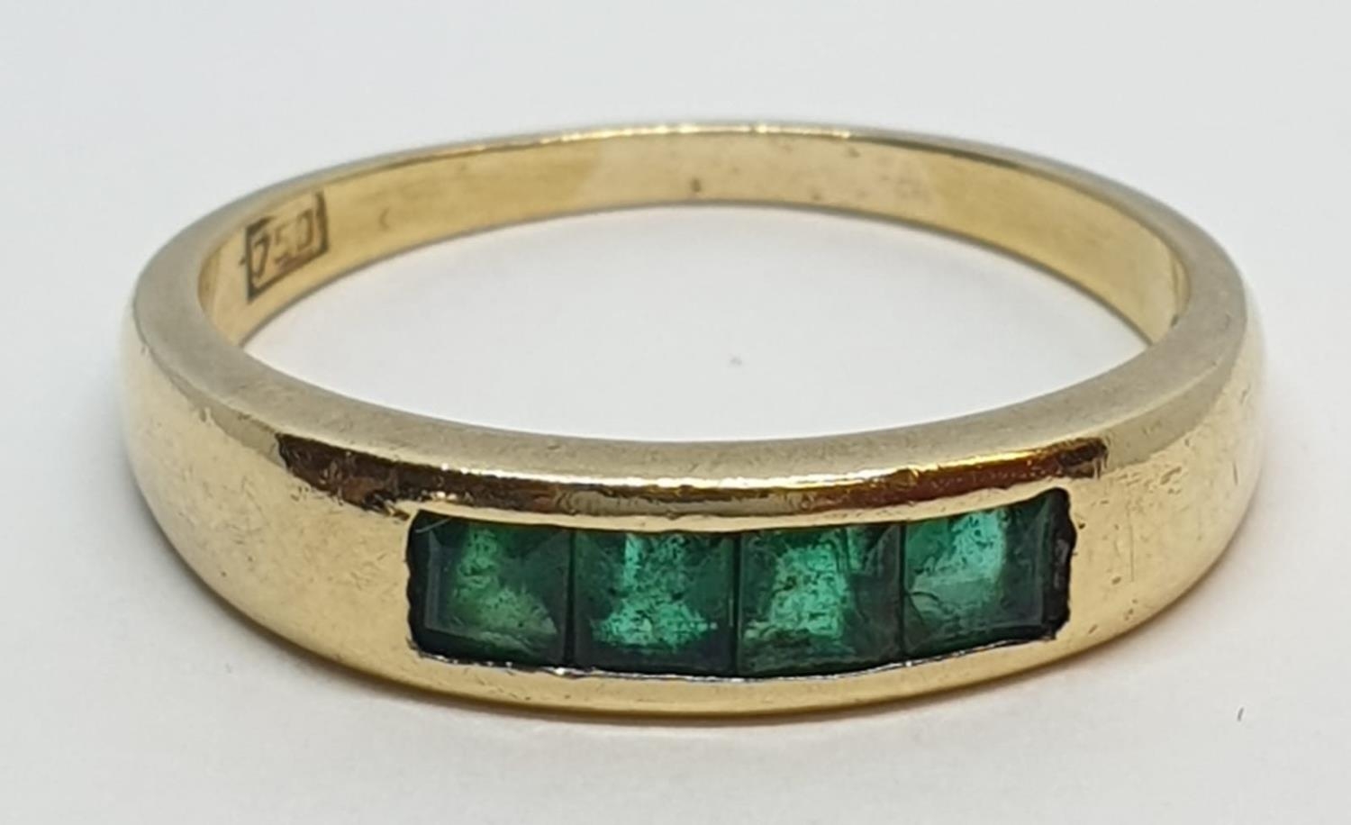 18ct Yellow gold emerald set band ring. Weight 3.8g, Size O.