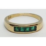 18ct Yellow gold emerald set band ring. Weight 3.8g, Size O.