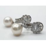 Pair of 18ct gold pearl and white sapphire drop earrings in floral design, weight 6g and 2.5cm
