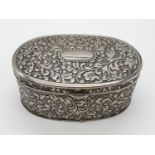 Ornate white metal trinket box with velvet lining, 10.5 x 7cm approx