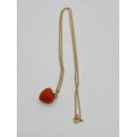 Strawberry pendant set on yellow metal chain, weight 3.7g and 49cm long approx