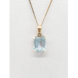 Aquamarine colour pendant on a 42cm 9ct gold chain. Weight 1.4g.