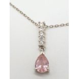 Silver chain and pendant,having clear stone strip leading to pink faceted pear shaped gemstone,