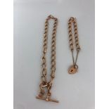 9k gold set to include belcher chain necklace with T-bar and bracelet with heart padlock; each