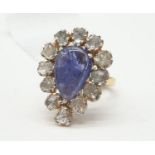A Pear Cabochon Tanzanite Diamond ring with White flat diamonds in sterling Silver, weight 7.7g