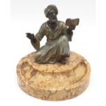 Ashtray of a Moroccan preacher man figurine on a marble base. Height 11cm.