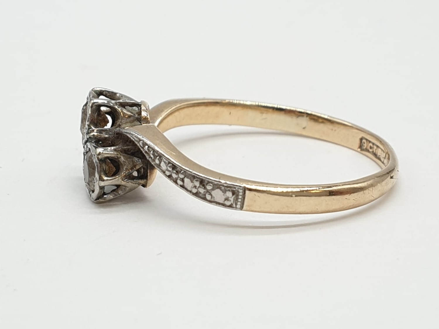 9ct Gold and platinum ring having two pale aqua stones to top in crossover style. Preserved in - Image 7 of 7