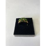 9ct gold ring having green diopside stones and 6 diamond points set to top. Full 9ct gold