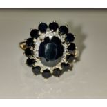 9k yellow and white gold with oval blue sapphire centre (9.05x7.02mm) and 1.25ct diamonds