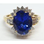 18ct yellow gold ring with 4ct tanzanite centre and further diamonds surrounding and on each