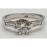 14ct white gold ring with 1.02ct diamond centre (colour J, clarity VS1) and 2 baguette cut
