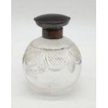 Cut glass scent bottle with tortoise shell and H/M silver top. 9.5cms in height.