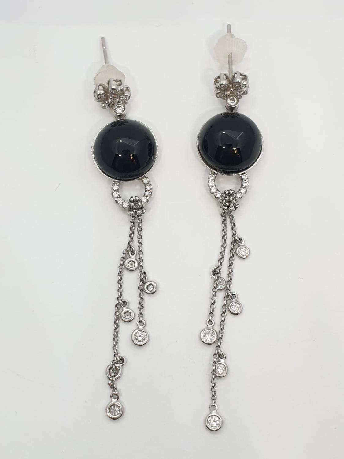 Pair of Onyx and diamond drop earrings set in 18ct gold, weight 10.13g and 7cm drop approx