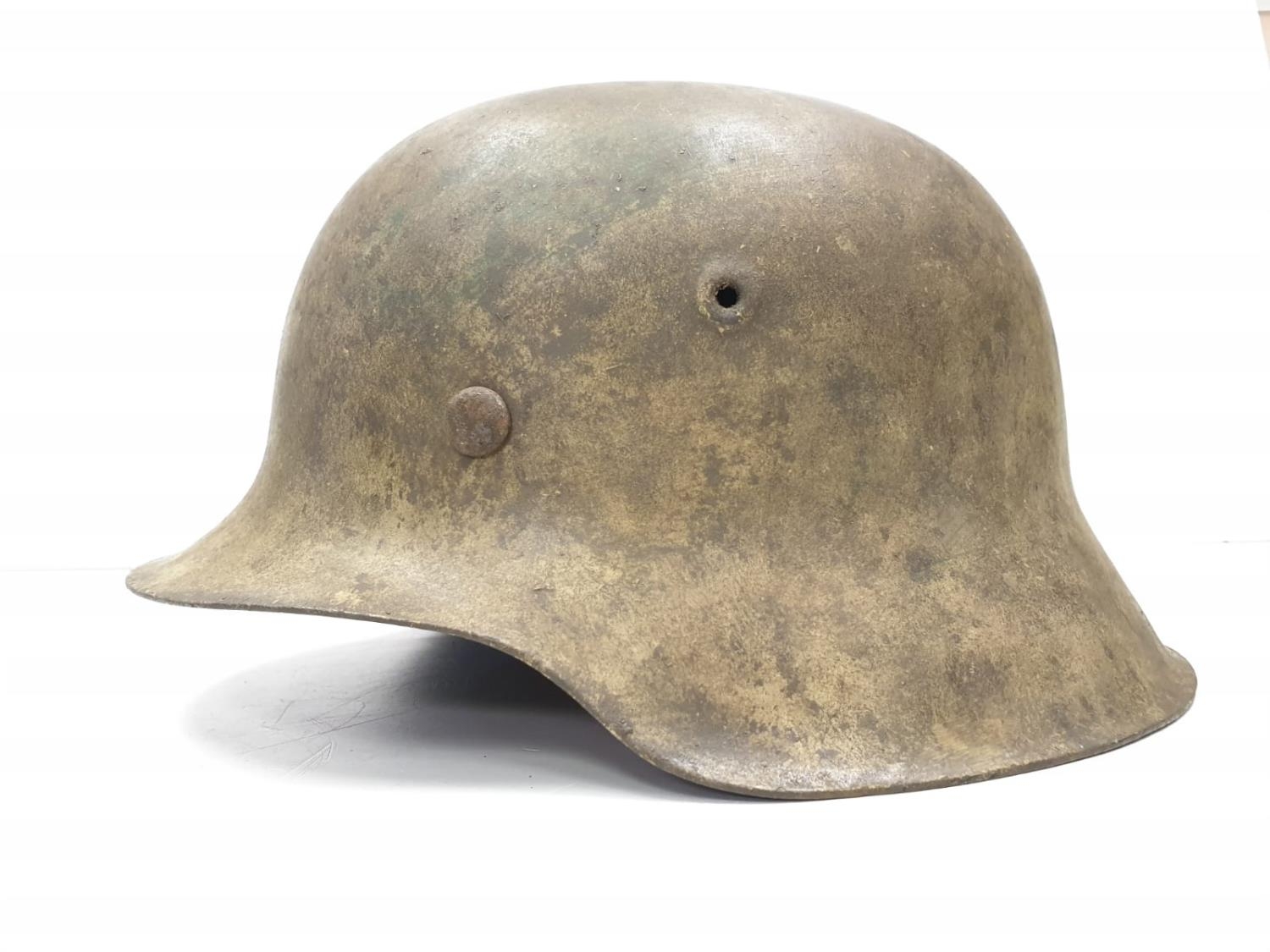 WW2 German M42 Normandy Helmet. This helmet is a typical post 1943 variant in slate grey workshop