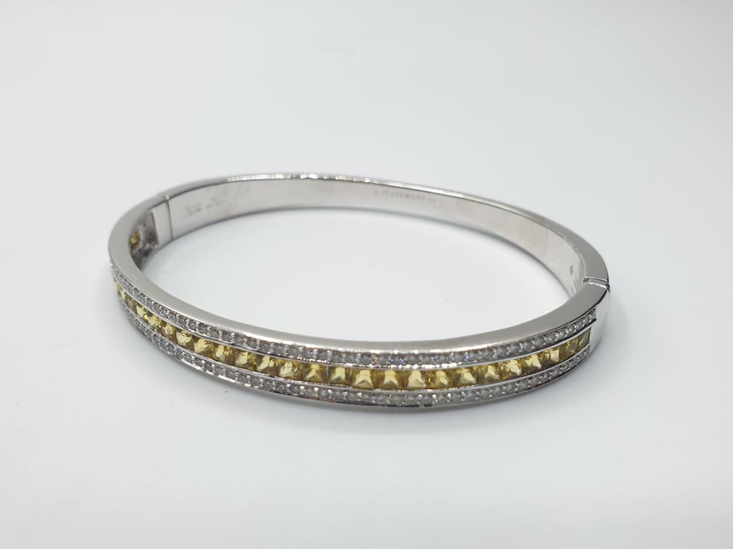 18ct White Gold Hinged Bangle with Channel Set Diamond ( 0.90ct) and Yellow Sapphire Designed by