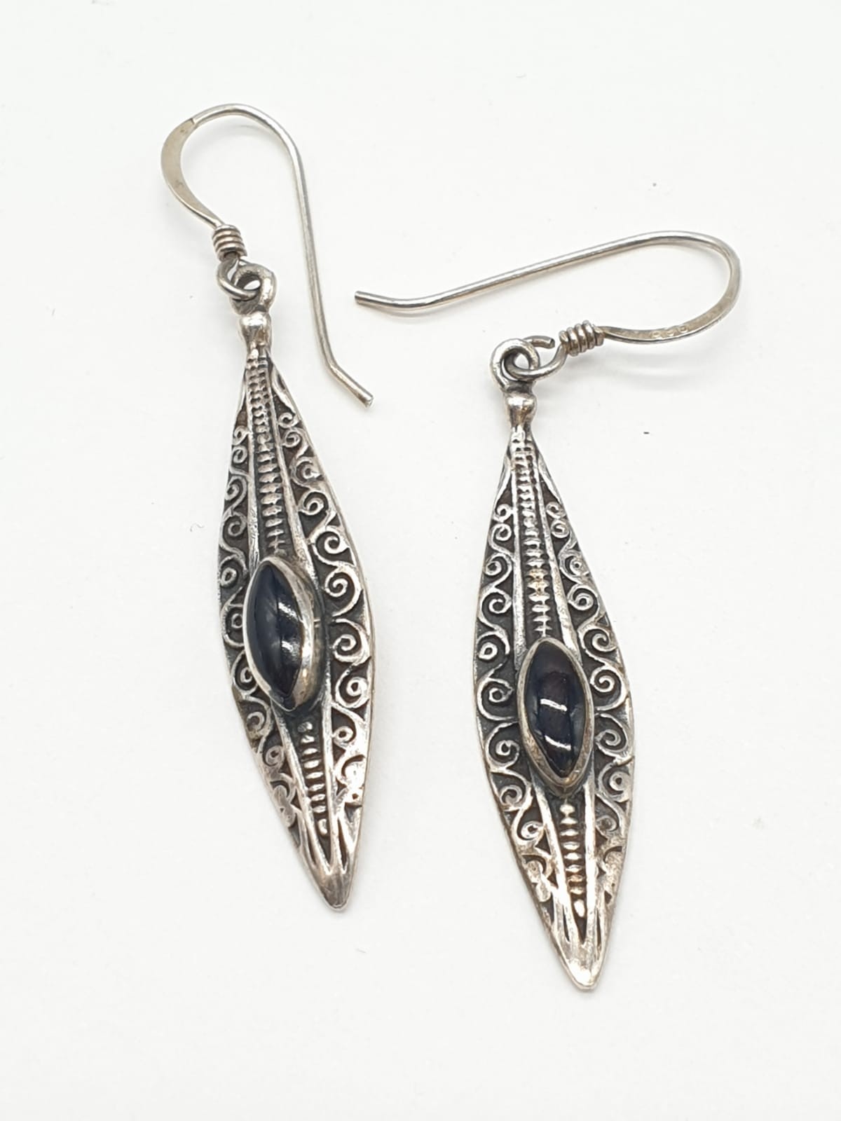 A pair of silver and black onyx earrings. Boat shaped. Marked 925 silver. Gift boxed.