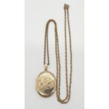 9ct gold vintage locket on a 9ct gold 60cm long chain, weight 10.71g