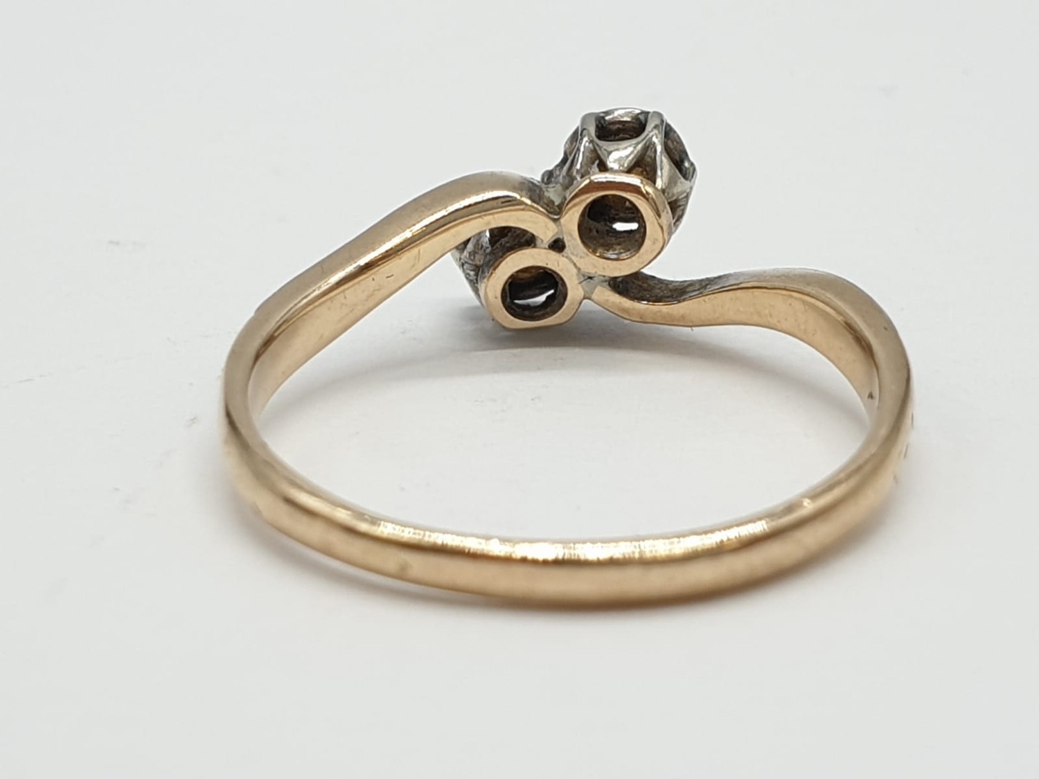 9ct Gold and platinum ring having two pale aqua stones to top in crossover style. Preserved in - Image 4 of 7