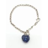 Silver belcher link bracelet having two heart charms pendants. 1 x Large blue sodalite type heart. 1